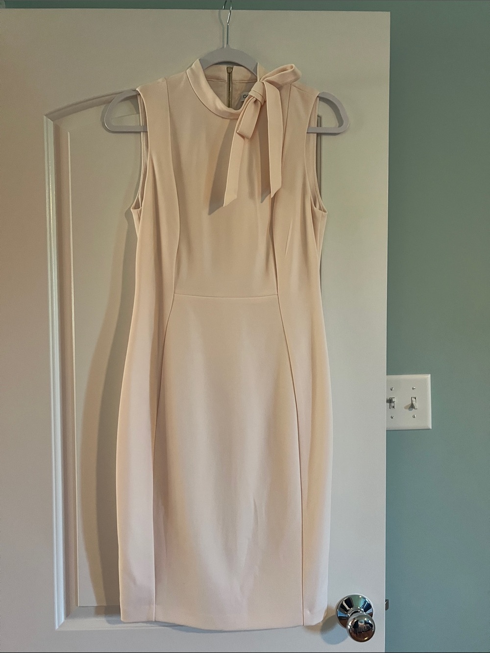 Calvin Klein Sleeveless Midi Sheath Dress in Pale Cream with Bow Neck